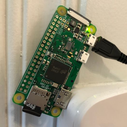 A naked Raspberry Pi Zero in a temporary location.