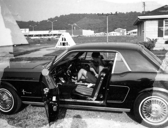 Mom in her 1965 (?) Mustang. I love the look of this photo, showing its age. She looks like she might be looking at a CD cover, but that would be a twenty-year anachronism. Notice you could buy food then, just behind the weeteepee house. Convenient.Mom says: “This was made in Ft. Thomas, Kentucky when your dad and I were dating. Probably in the late sixtys.”